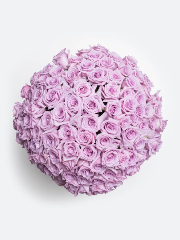 A breathtaking top view of 100 lavender Ocean Song roses, artfully arranged to showcase elegance, expert craftsmanship, and luxurious floral design.
