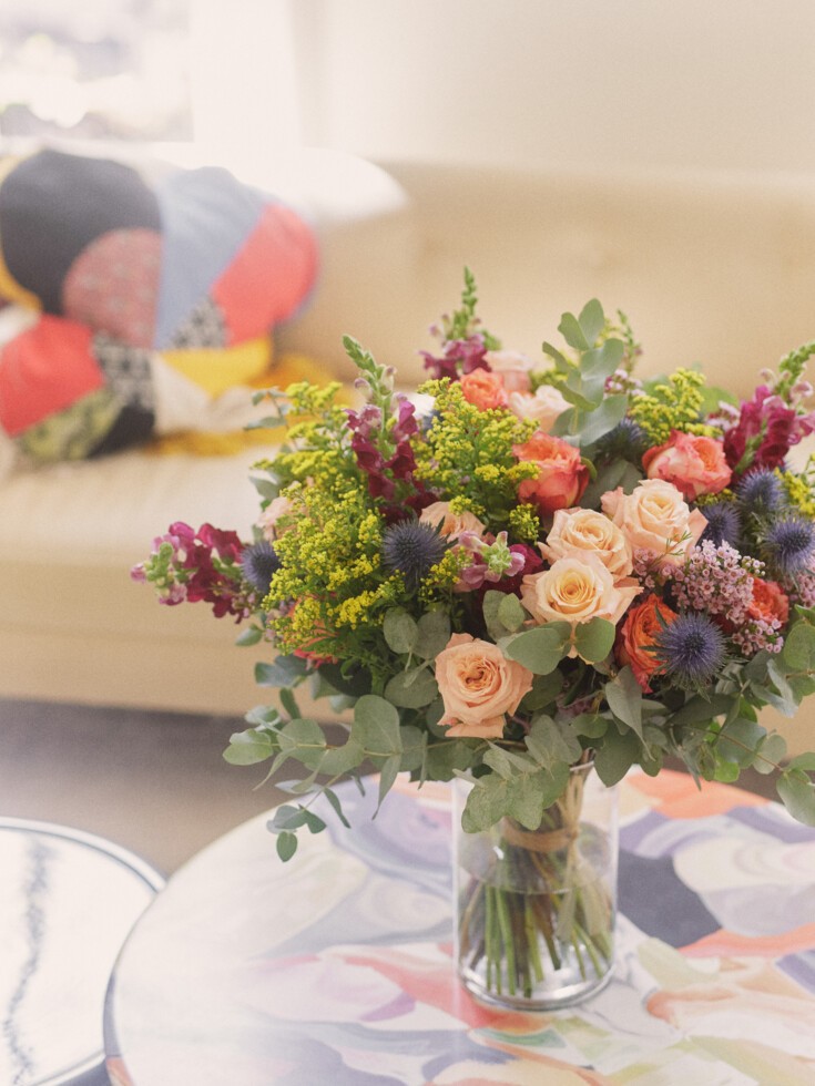 Augustine bouquet in vase on table in living room