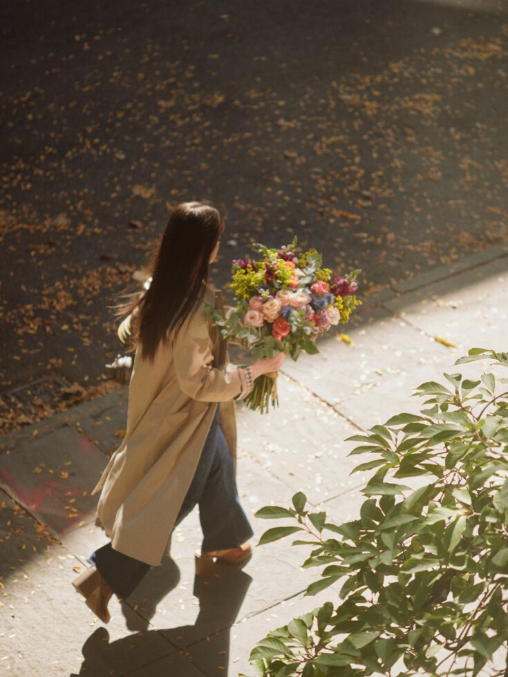 Augustine bouquet being held on sidewalk