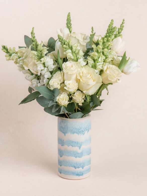 Elegant Paulette bouquet with 26 premium white stems, including roses, snapdragons, and tulips, designed for weddings, anniversaries, or refined home styling.