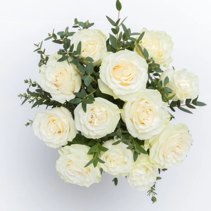 The 12-stem Josephine bouquet features White Mondial roses with soft green-tinged petals.